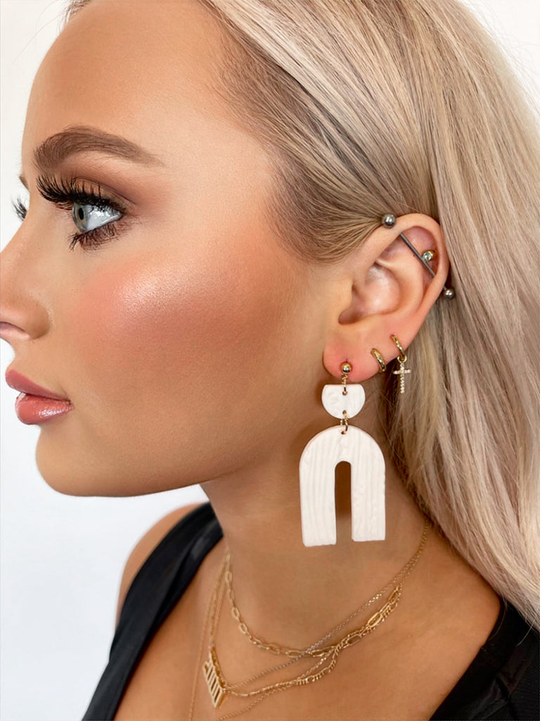white arch earrings